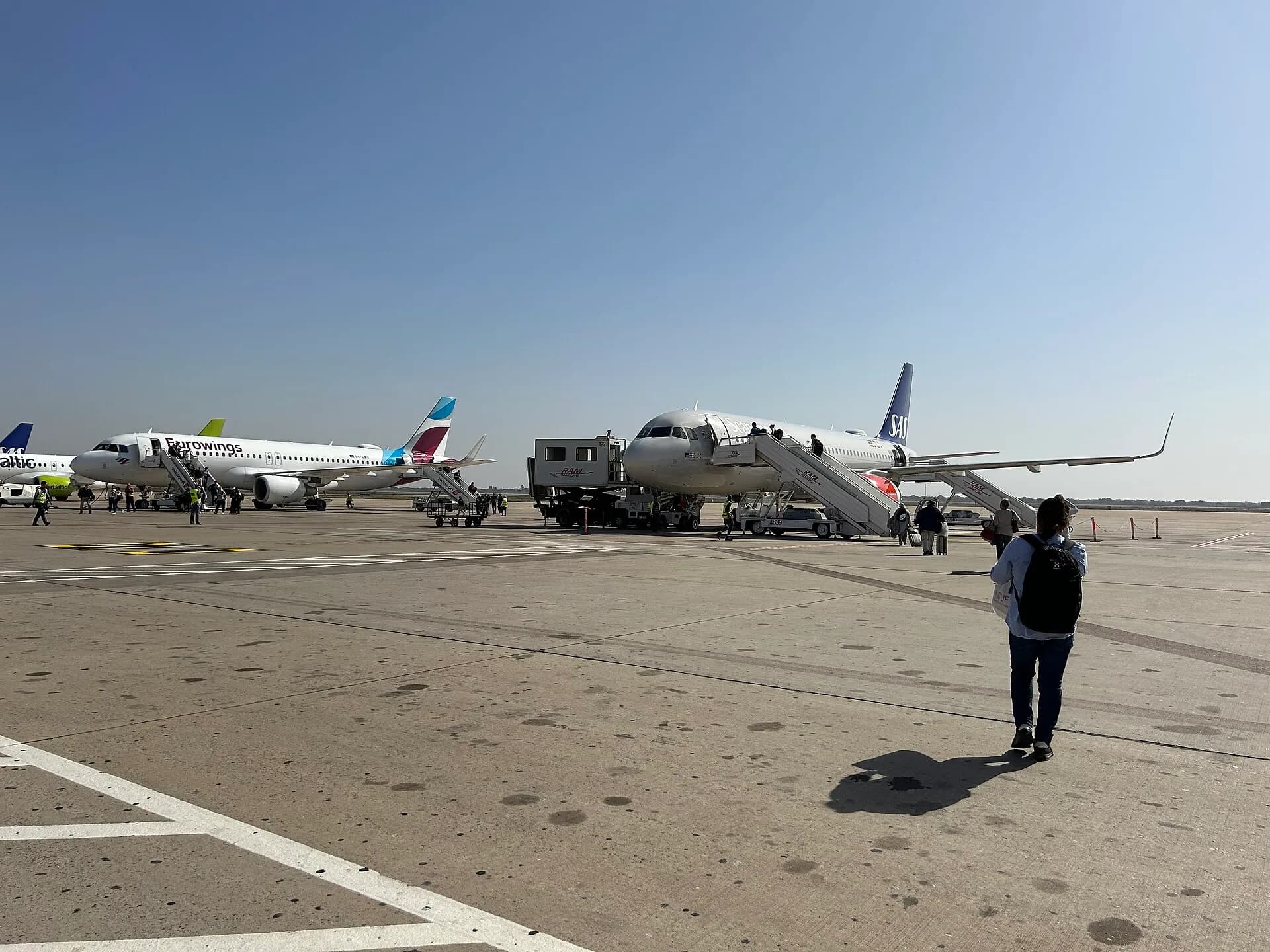 Traveller walking across the apron at Agadir–Al Massira airport